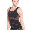 A model wearing a black and gold seamless yoga vest with curved designs under the bust and wide straps