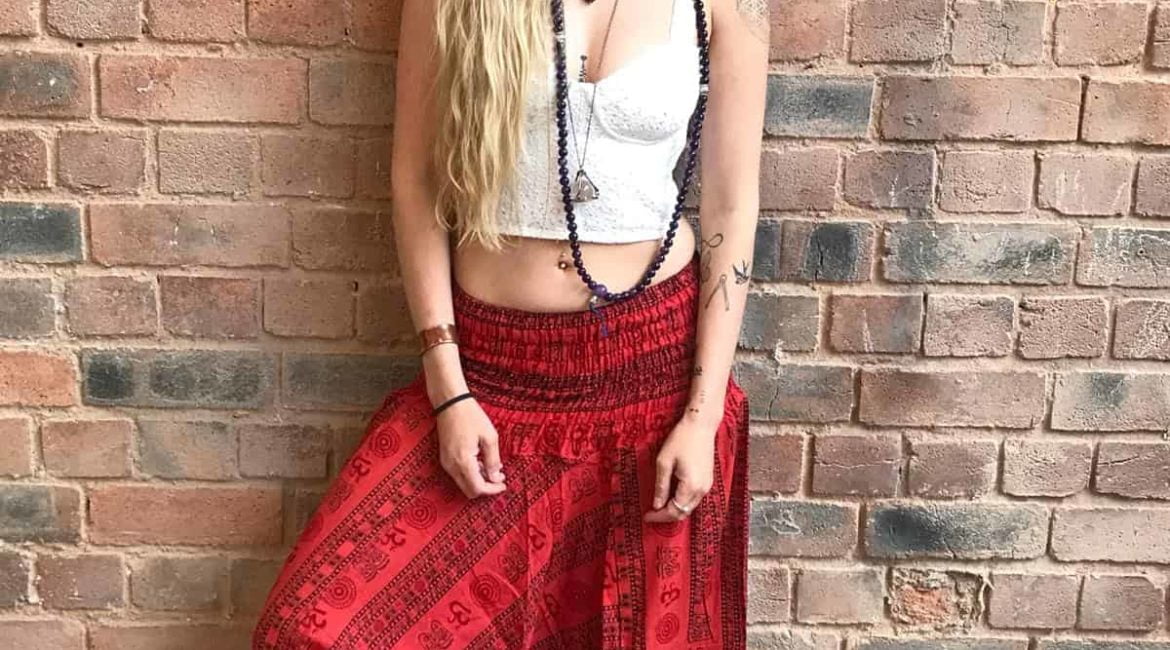 baggy hippy pants in bright red with loose low waist and spiritual om print