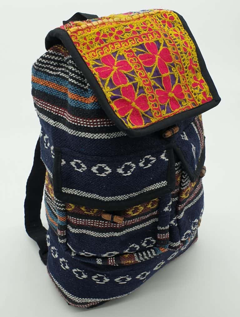 nepalese cotton hippy backpack with two pockets and a top panel made from recycled embroidery, which is unique to every item