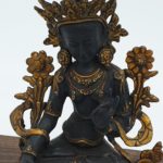 Cast bronze black tara statue with gold accents and mudras.