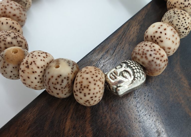 Lotus seed Buddha head necklace. Natural spiritual jewellery made from lotus seeds.