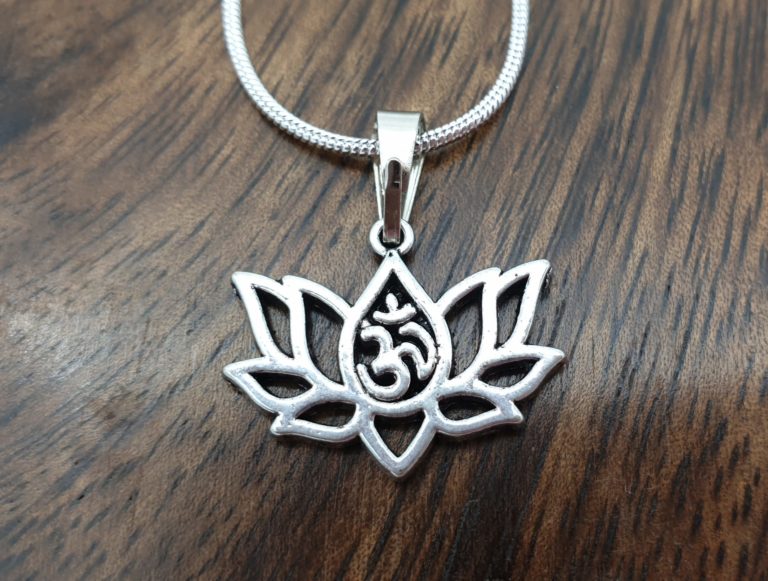 silver om lotus necklace on a silver plated snake chain. A delicate piece of spiritual jewllery.