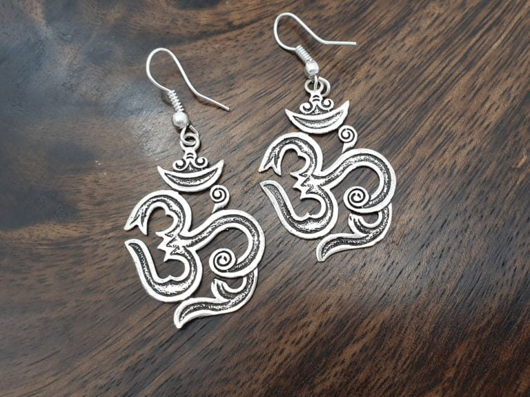 Sterling silver om aum earrings in a calligraphic style on fish hook ear wires