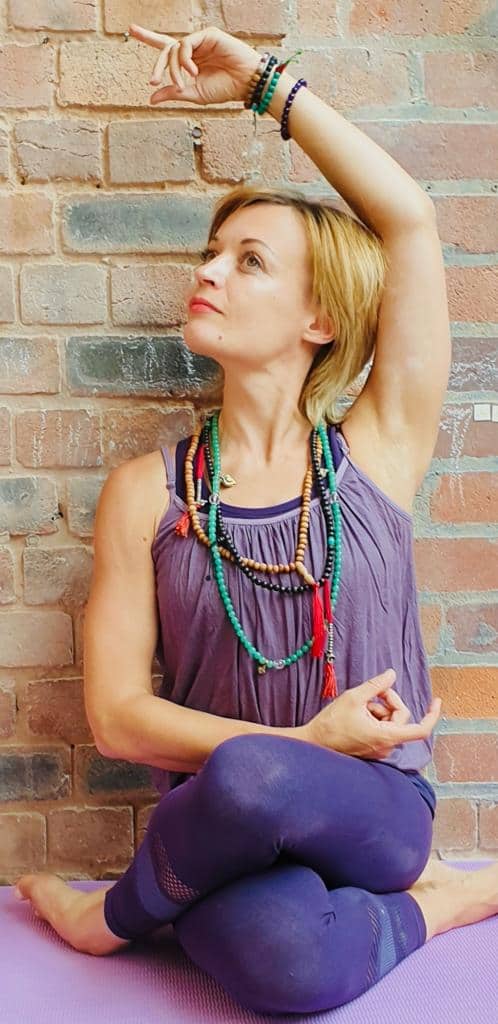 Our new Yogamasti ambassador Yoga teacher Rebecca Hannah with her hands in different mudras