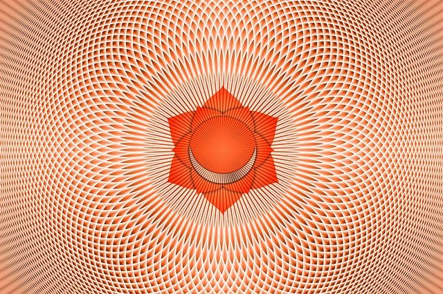 Illustration of the sacral chakra symbol with lines of energy moving inwards and outwards from it to symbolise common sacral chakra problems with the flow of energy