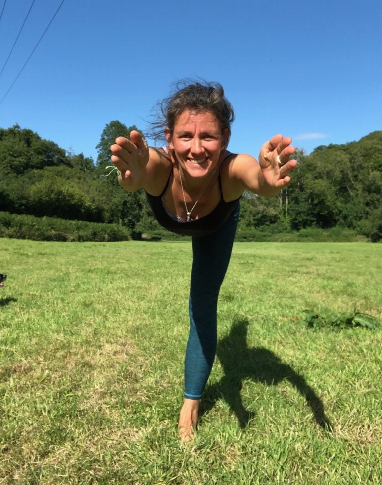 Yoga teacher Terry Bruce interview practicing Yoga in a field.
