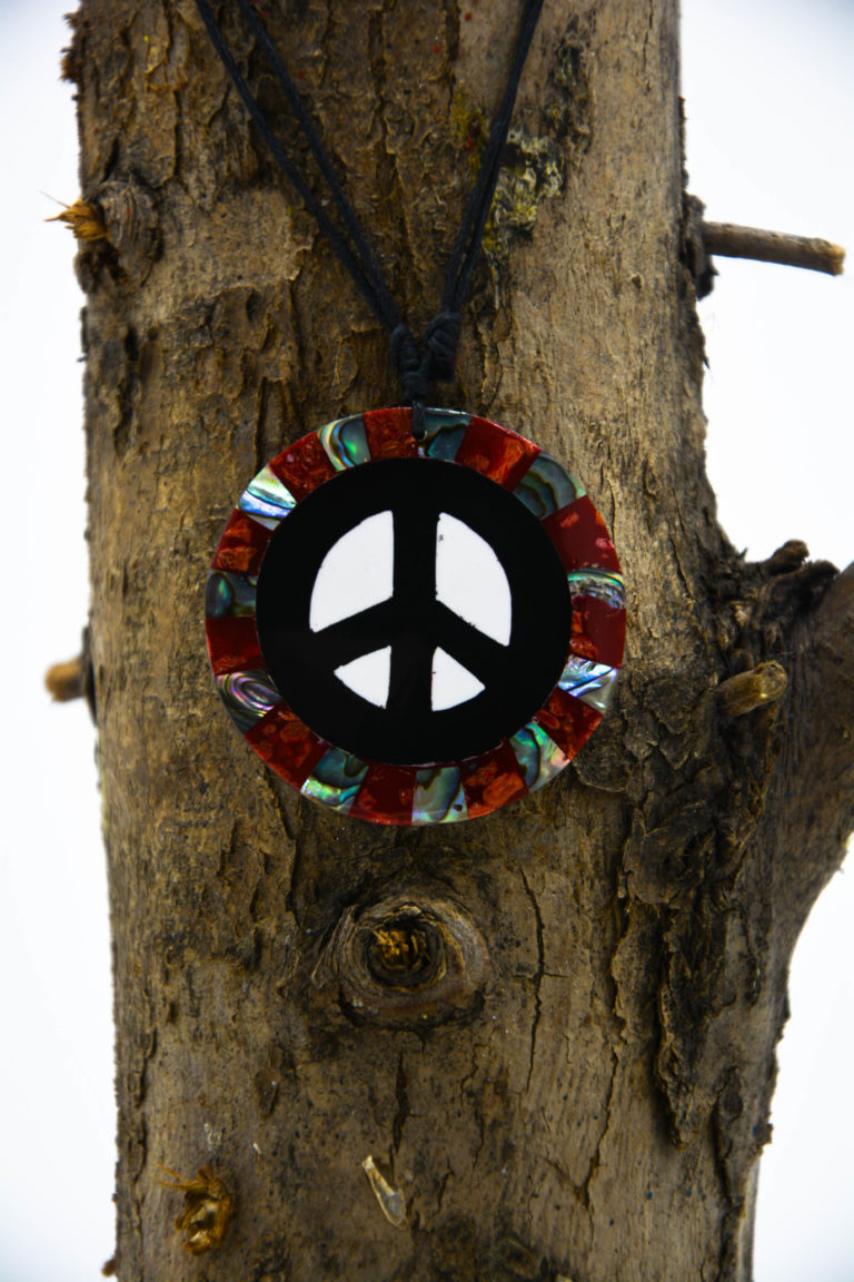 abalone shell circular mosaic necklace with a peace symbol in the center