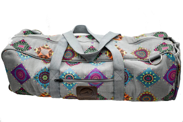 An extra large yoga mat bag with mandala patterns made from grey canvas with diamond shaped mandala patterns in pink, blue, green, purple, orange and yellow. It has two extra strong grey straps.