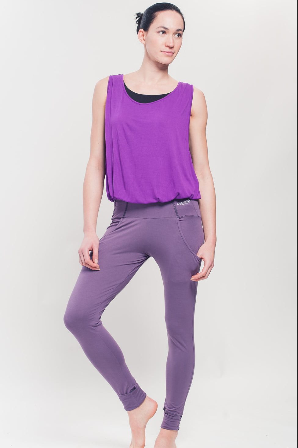 Easy Fit Yoga leggings with pockets on a model showing the front view. They are a soft lavender colour and full length