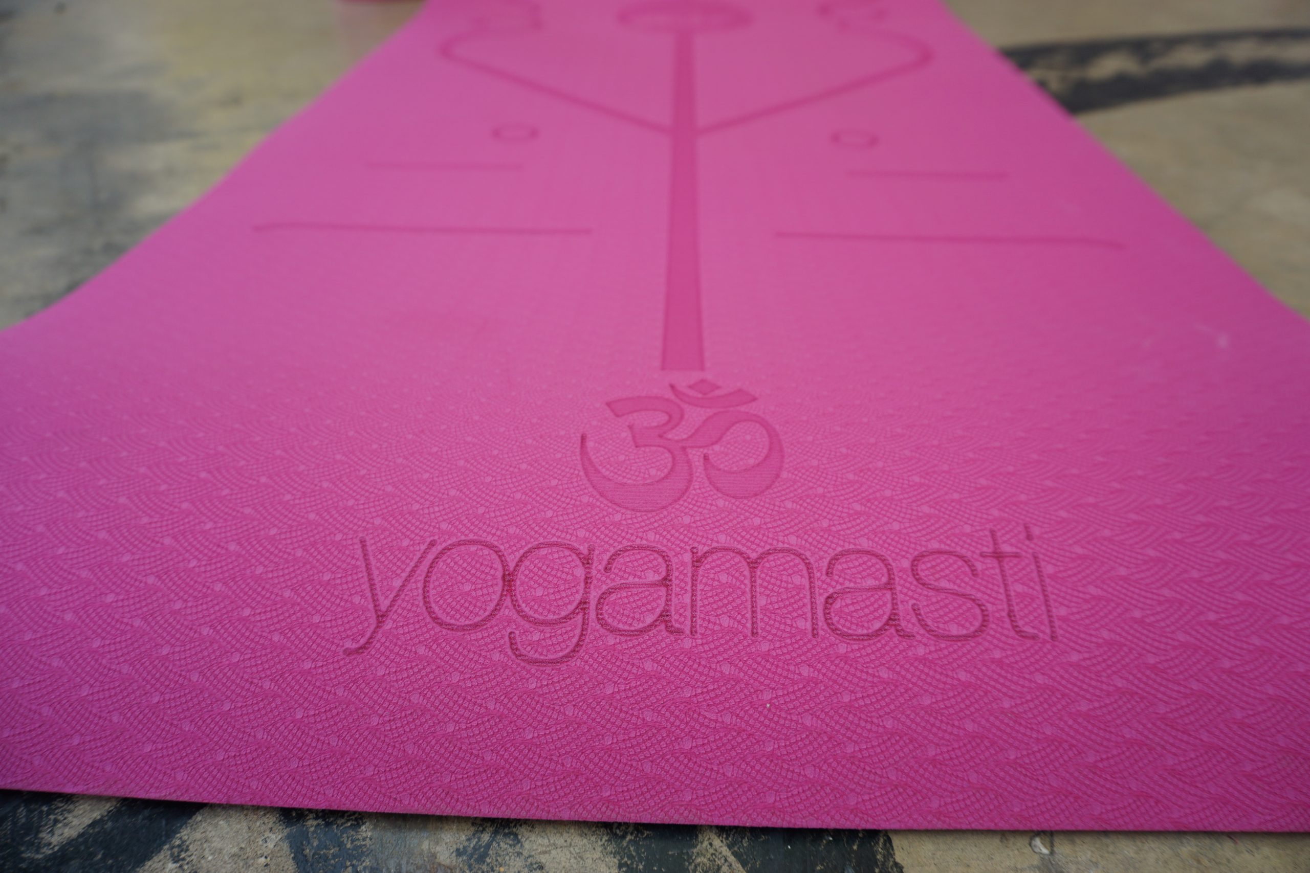 Yogamasti Pink Alignment Non Slip Yoga Mat with a 6mm thickness and engraved alignment aids