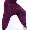 the harem pants from the comfort flow purple yoga outfit showing the volume of the pants
