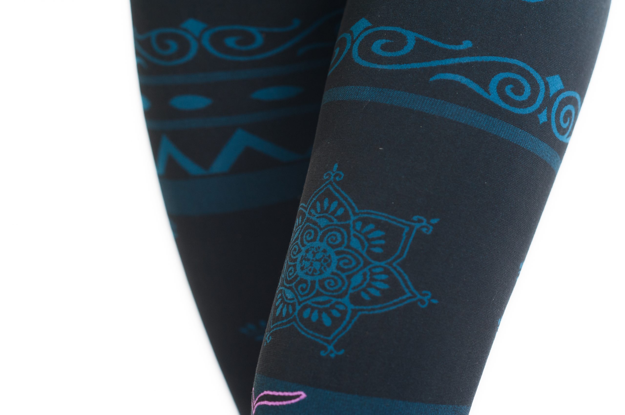 A close up of the leggings part of the balance organic outfit showing the mandala on the left thigh