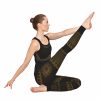 Bhakti black yoga outfit on a model with leg stretched out to show the mandala pattern on the right thigh
